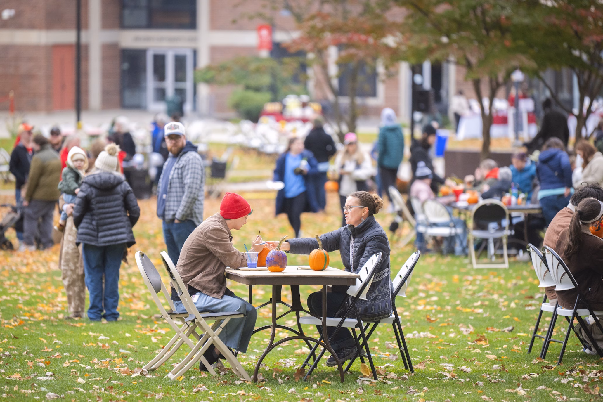people gather on campus green