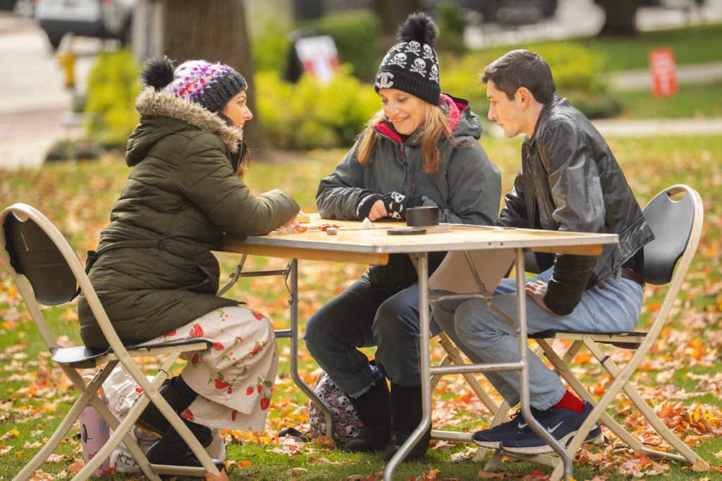 people gather on campus green