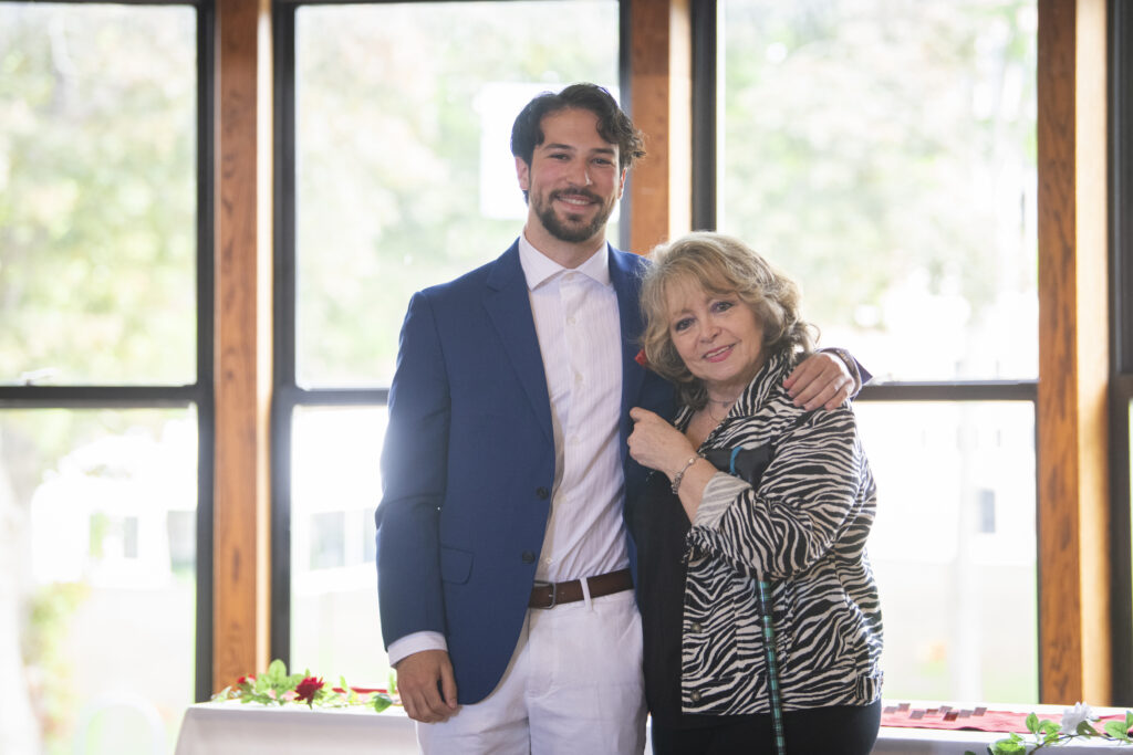 people pose for photos at First-Gen Pinning Ceremony