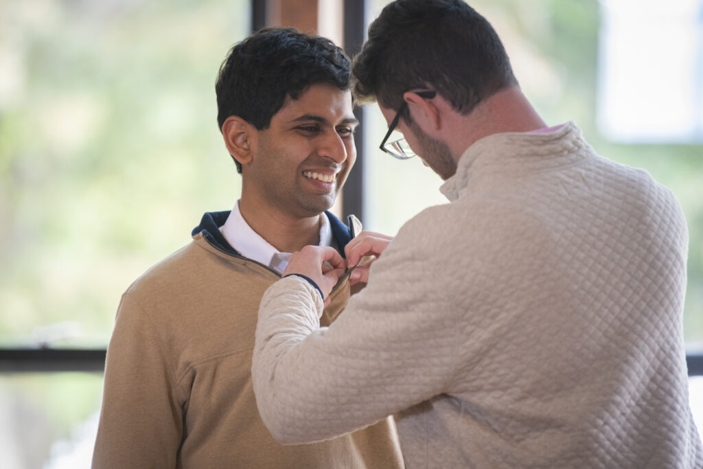 people pose for photos at First-Gen Pinning Ceremony
