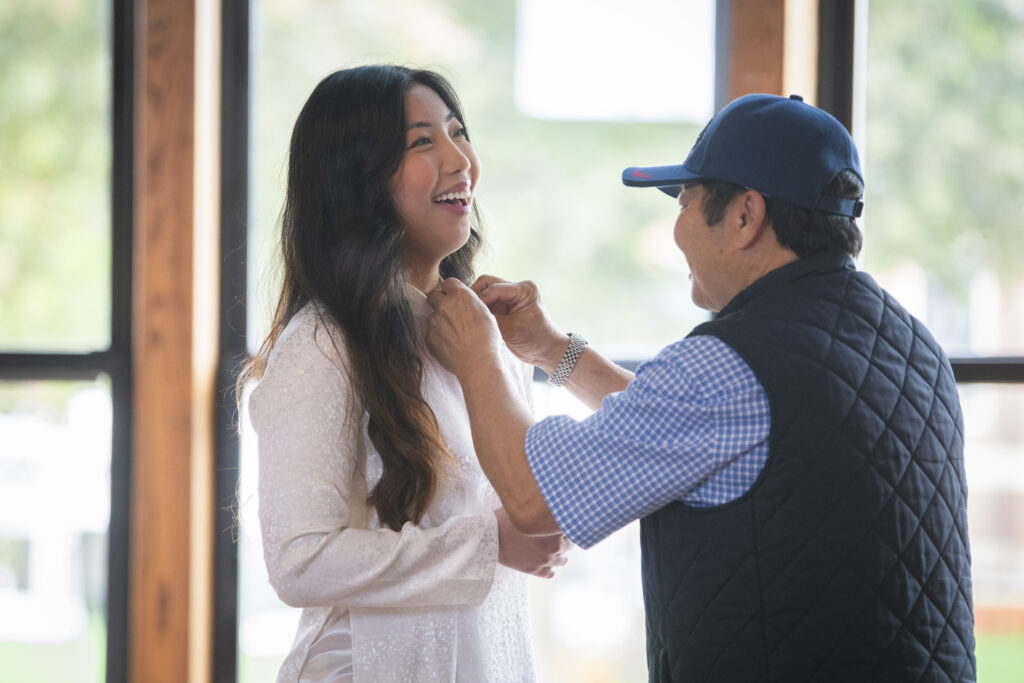people pose for photos at First-Gen Pinning Ceremony