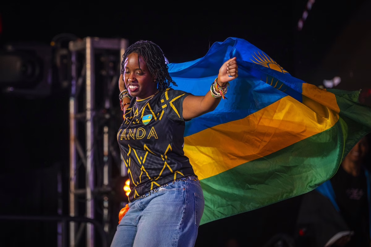 people on stage with flags