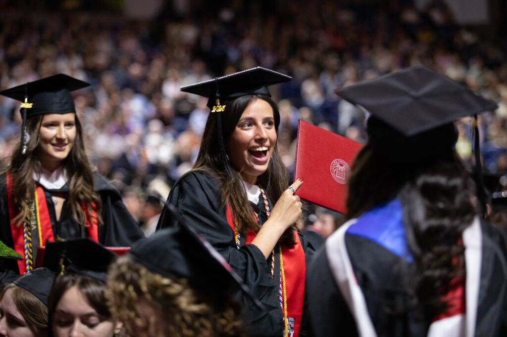 Clark University graduate with diploma
