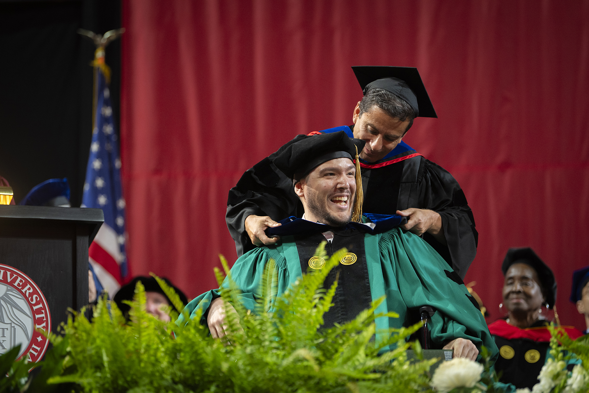 Ph.D. student is hooded during Commencement ceremony