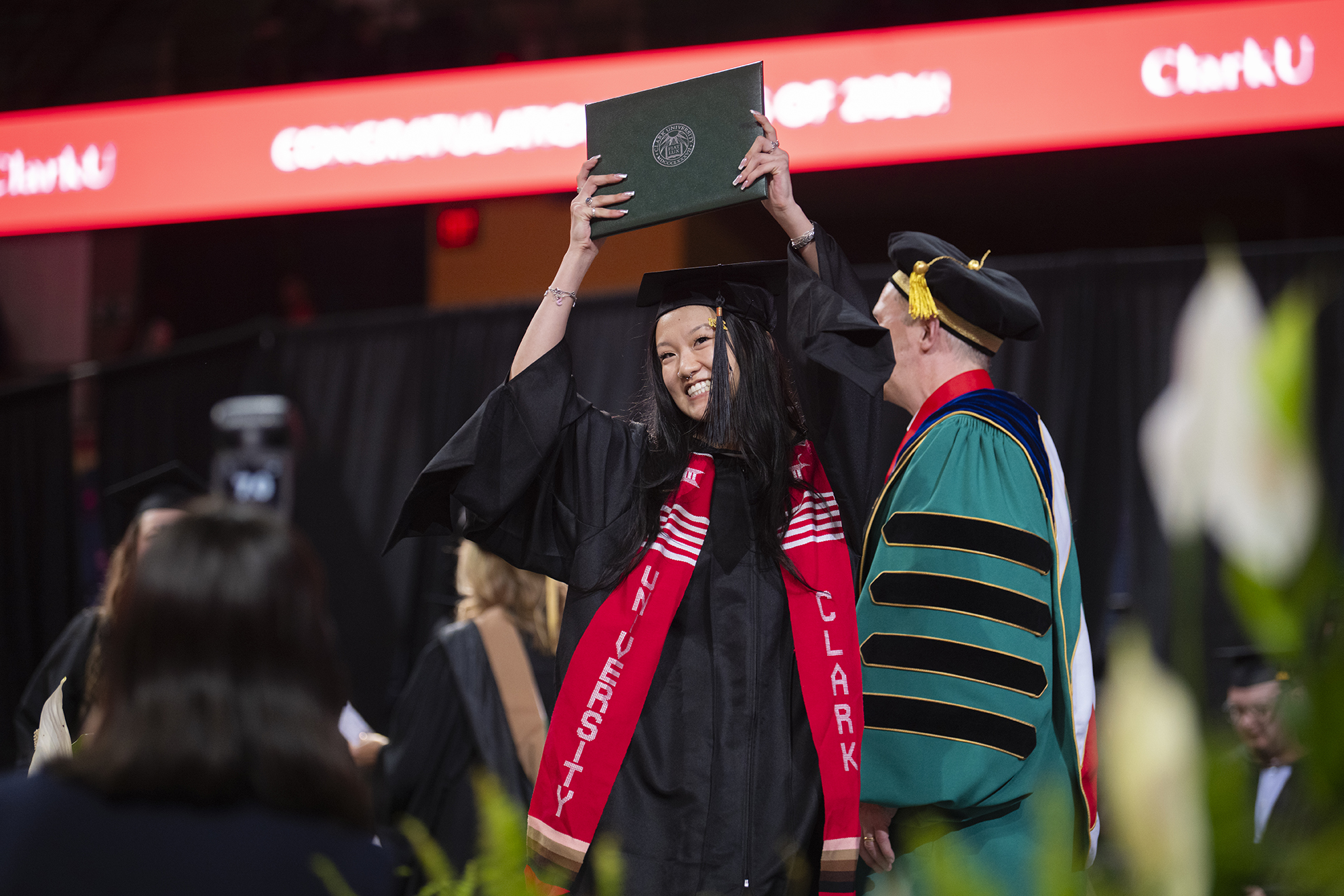 Student celebrates with diploma