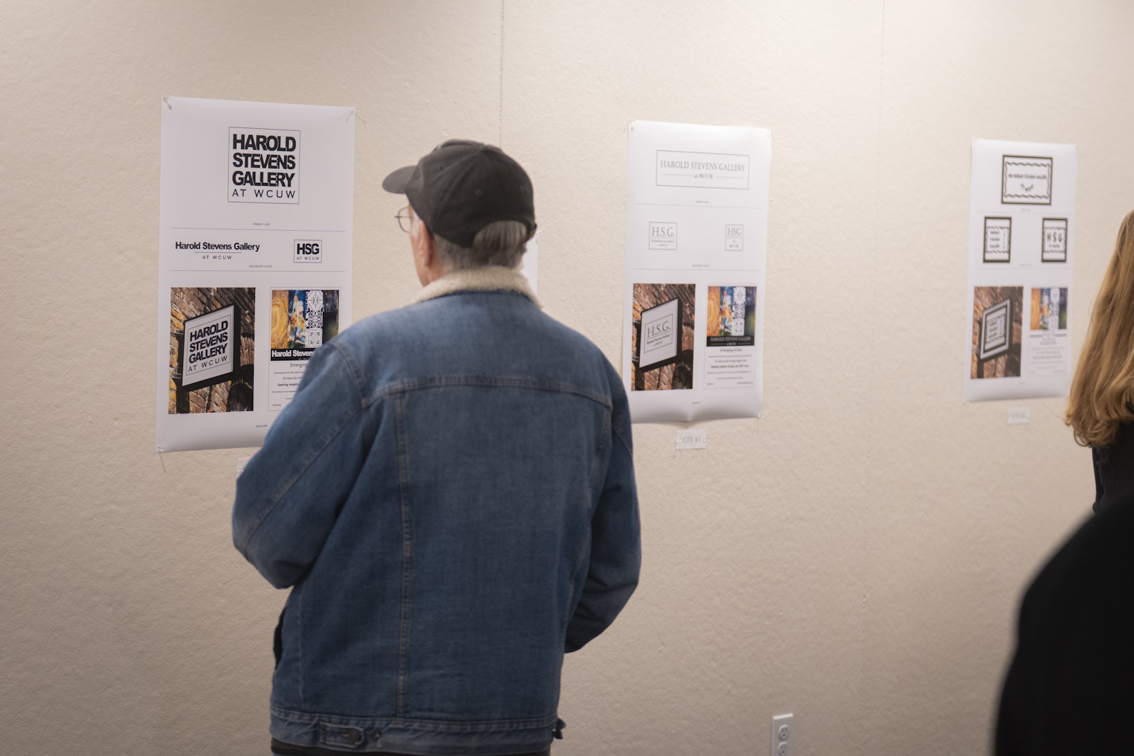 person looks at gallery show