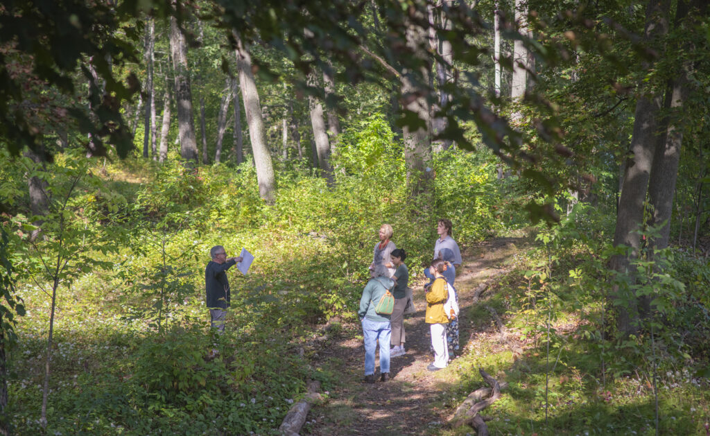 group of people in arboretum