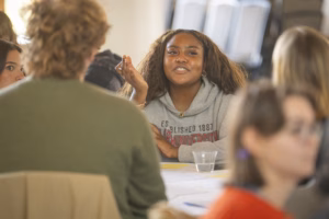 A student speaks during a roundtable discussion on America's 250th anniversary
