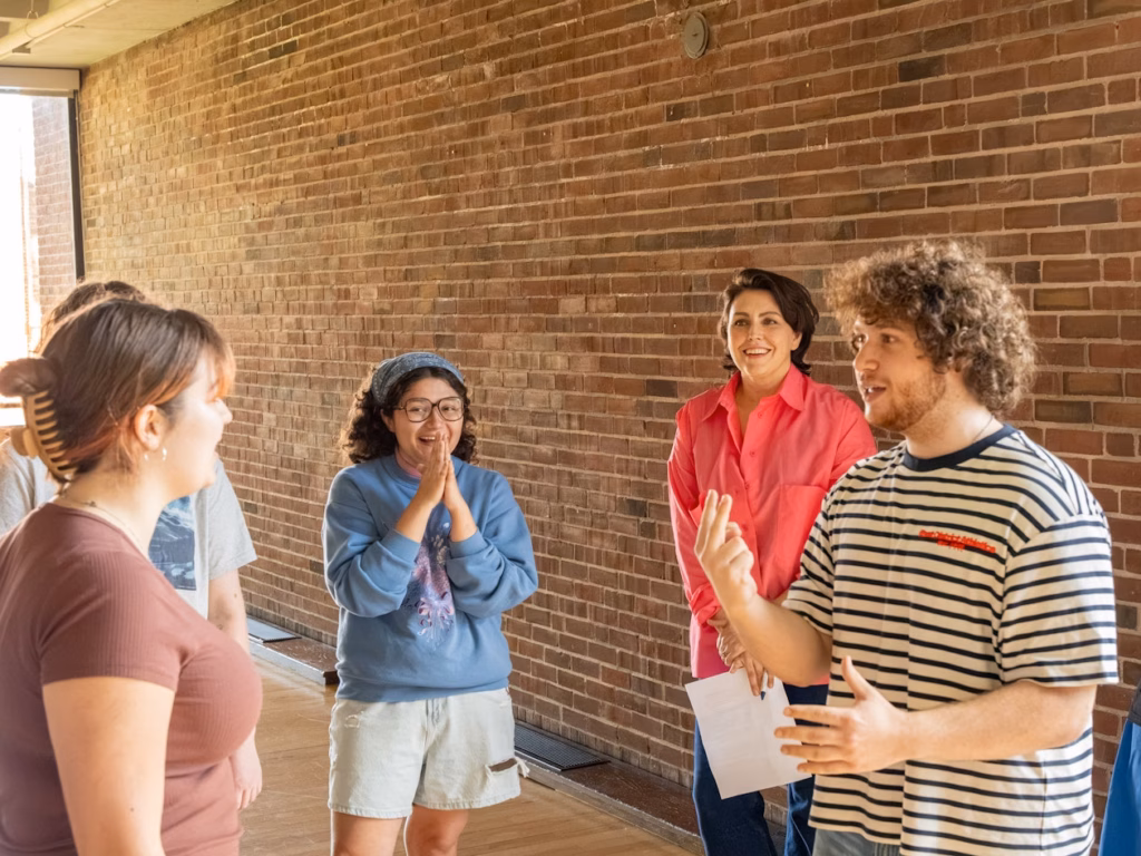 three students and actor during workshop