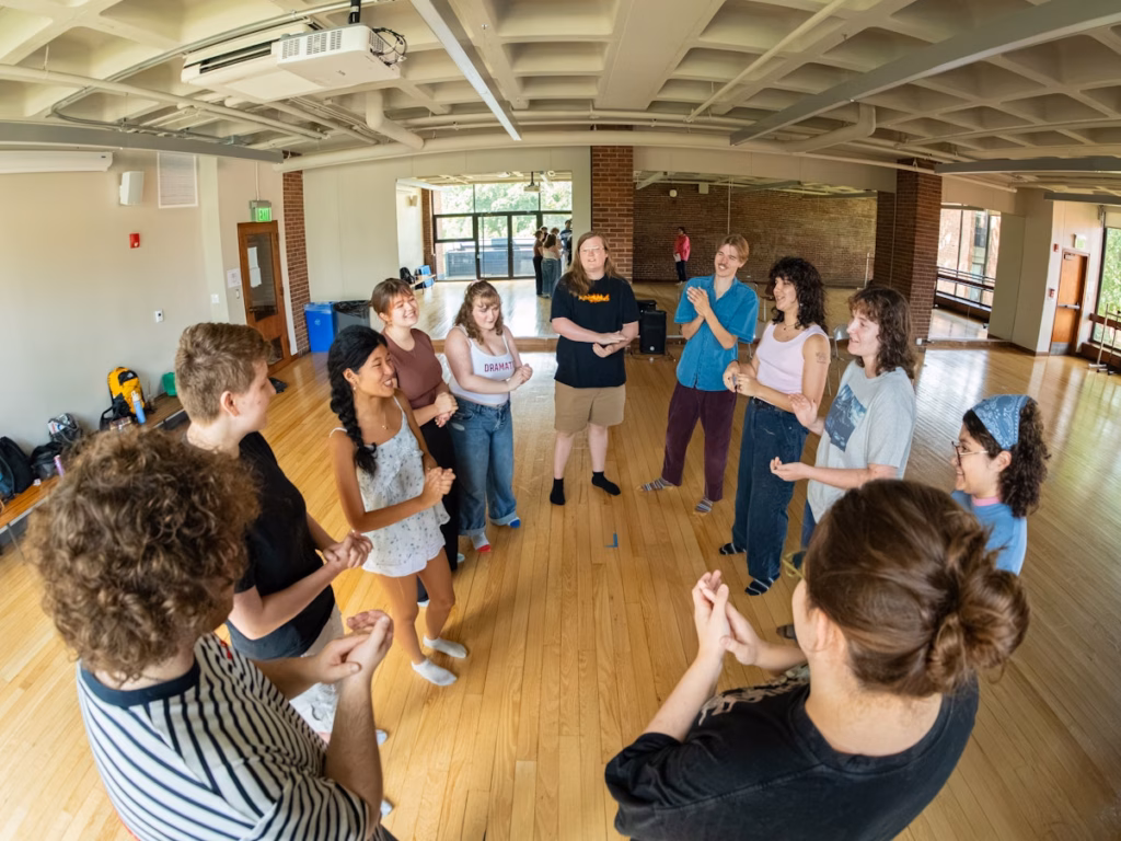 11 students stand in circle