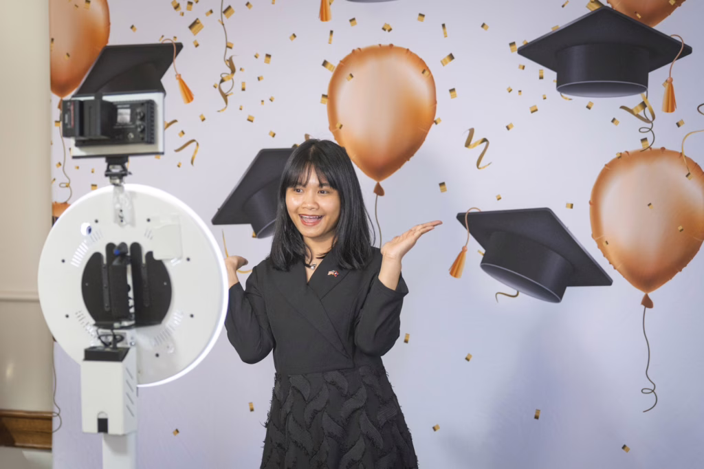 students smile at graduation ceremony