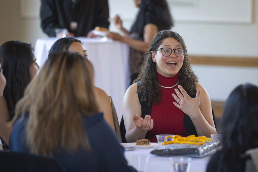 students smile at graduation ceremony