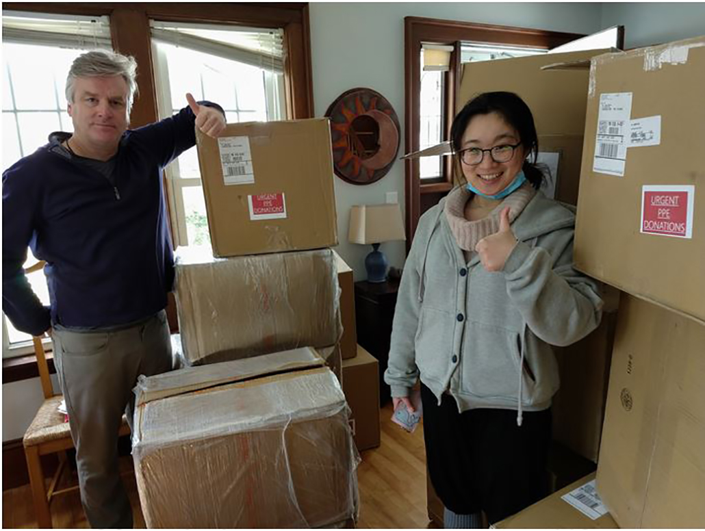 John Dobson and Xinyang “Yvonne” Li, MBA ’21 with PPE secured from China