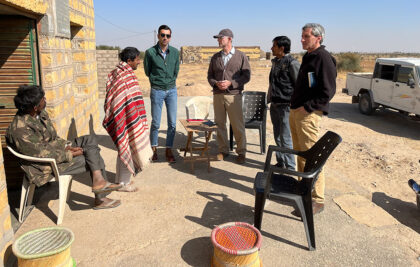 People in India talking outside a house