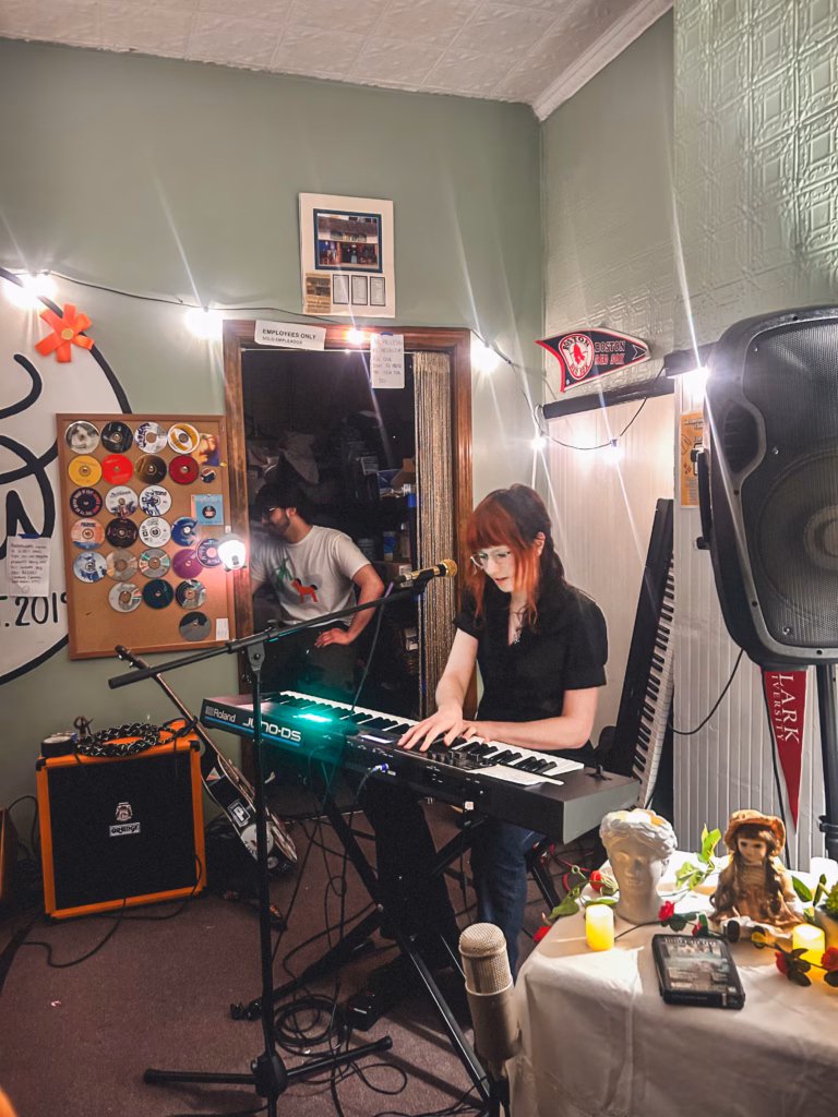student playing keyboard in green room