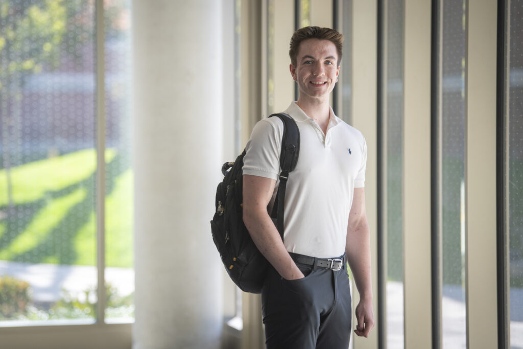 photo of student standing with backpack