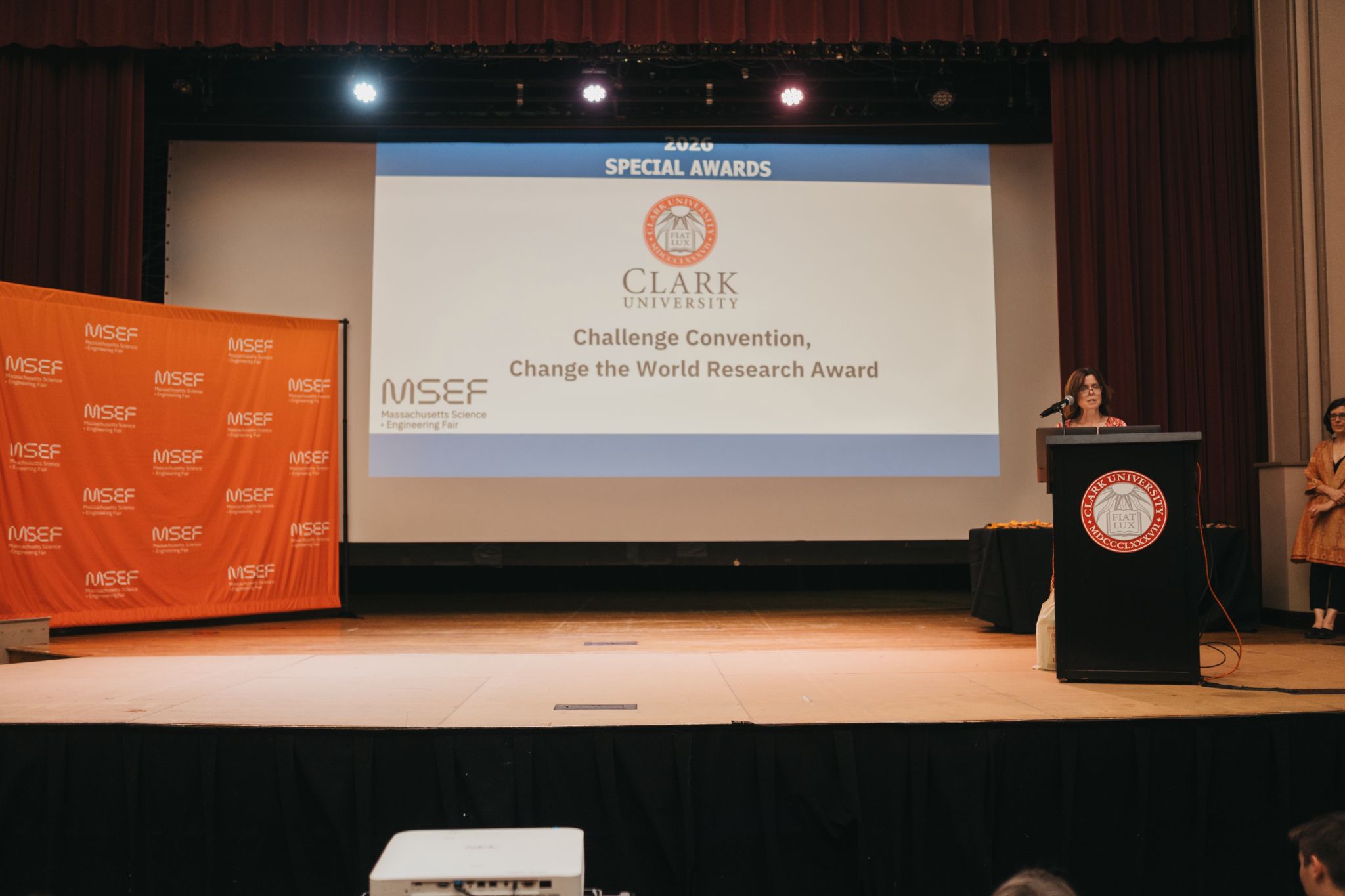 Jennifer Hanselman present remarks at the Massachusetts Science and Engineering Fair awards ceremony in Clark‘s Atwood Hall
