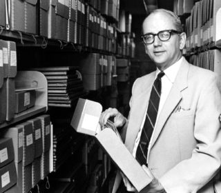 William Koelsch in the Goddard Library stacks
