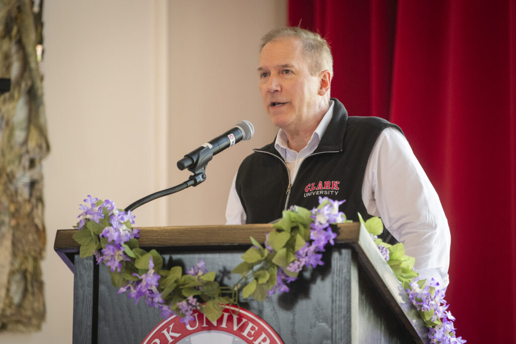 people pose for photos at lavender graduation ceremony