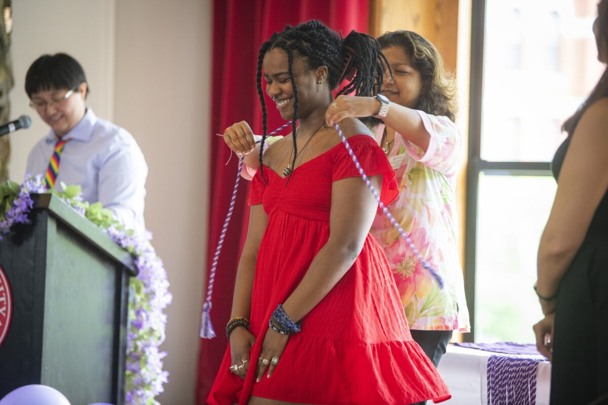 student gets graduation cord at lavender ceremony