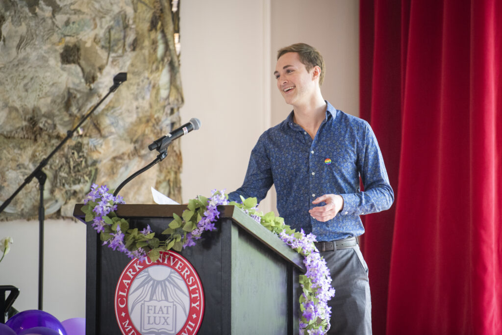 people pose for photos at lavender graduation ceremony
