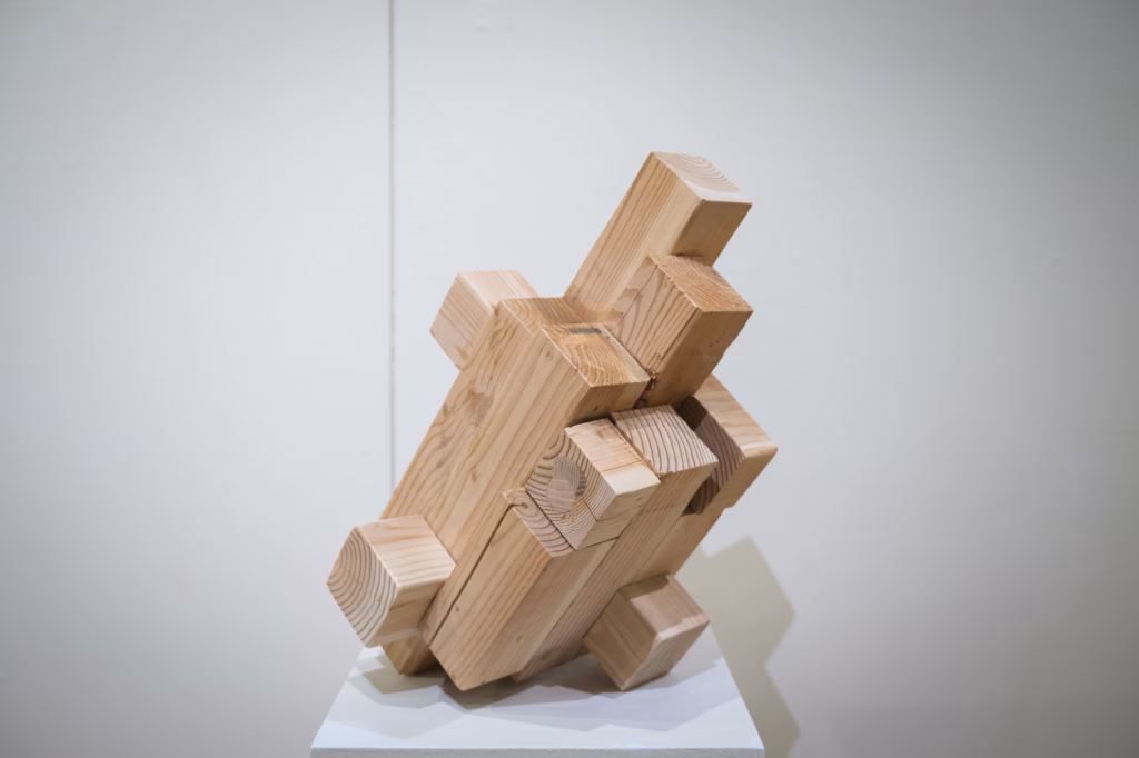 blocky, wooden art piece in gallery