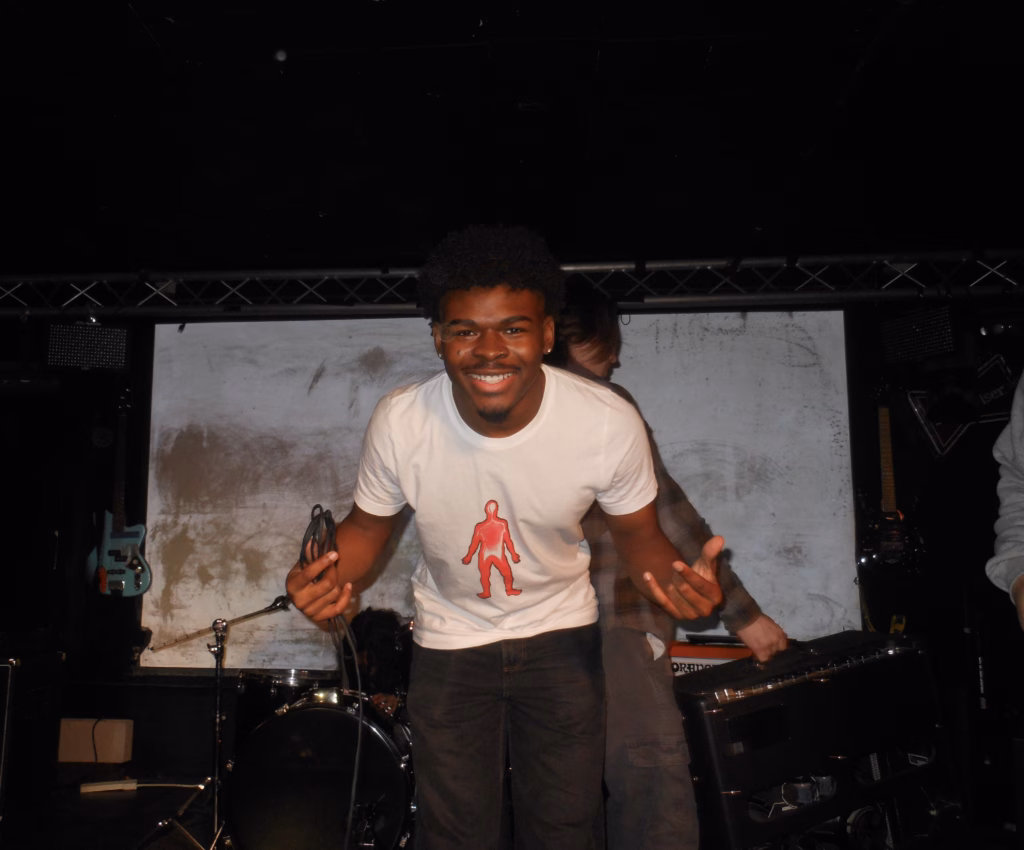 smiling student performing on stage