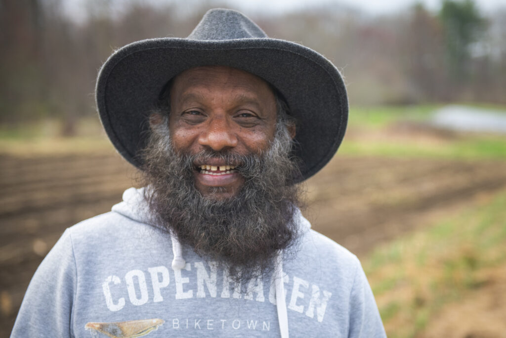 headshot of professor on farm
