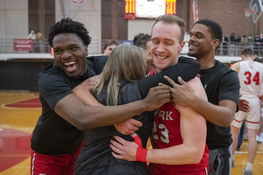 Clark University men's basketball team celebrates win in 2025 NEWMAC championship game
