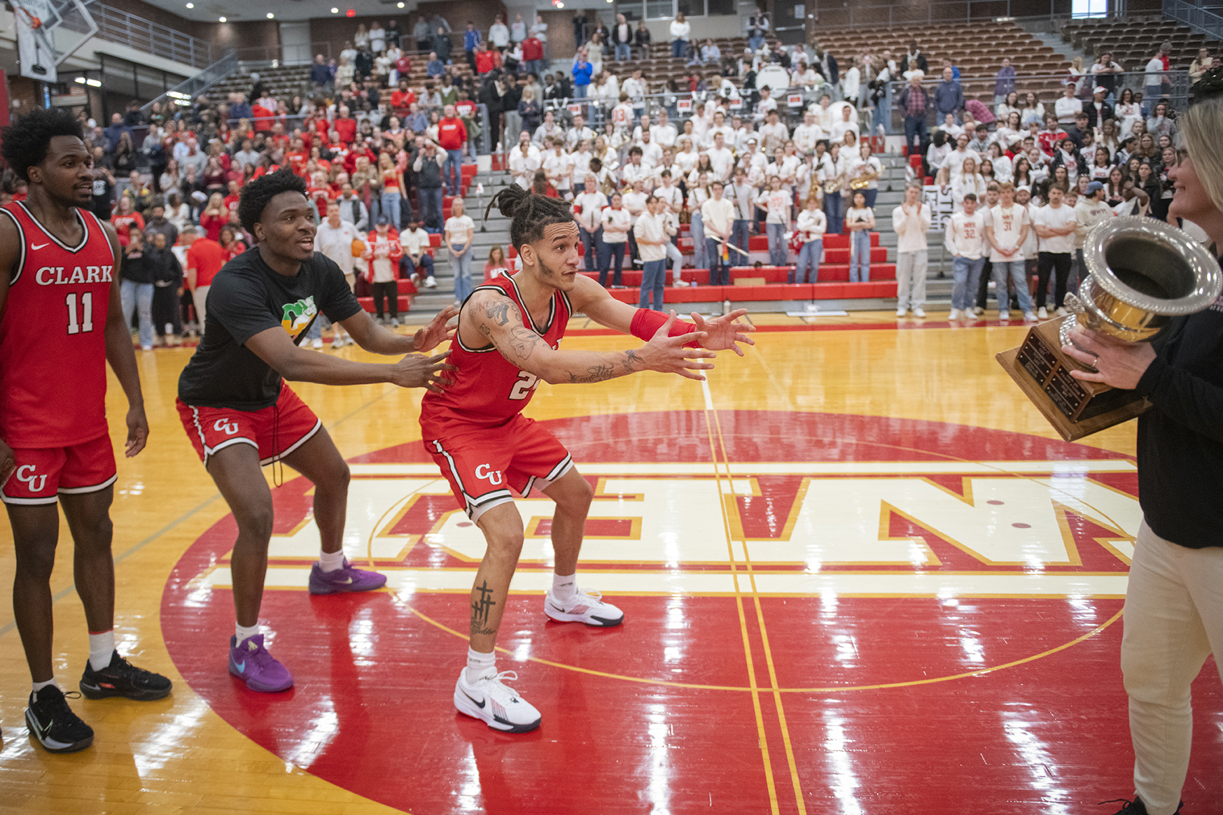 Clark University men's basketball team celebrates win in 2025 NEWMAC championship game