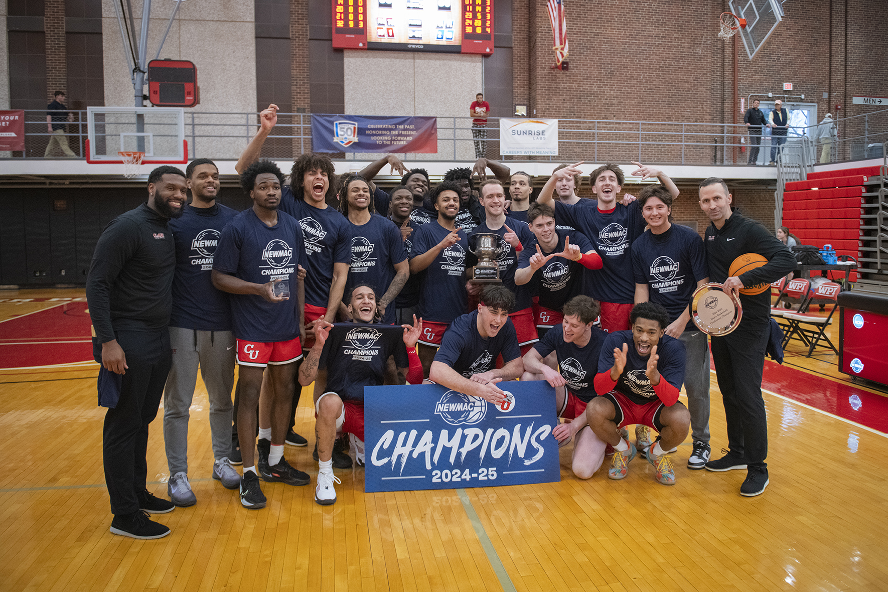 Clark University Men's Basketball team photo as 2024-25 NEWMAC champions