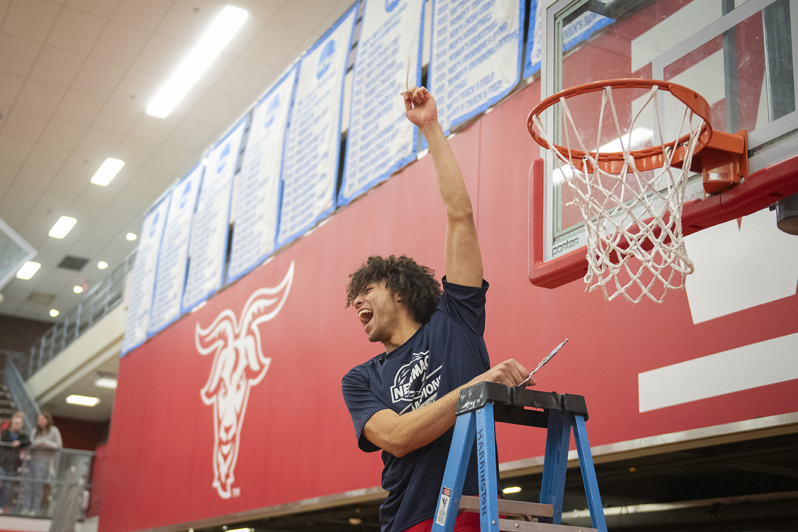 Clark University men's basketball team celebrates win in 2025 NEWMAC championship game