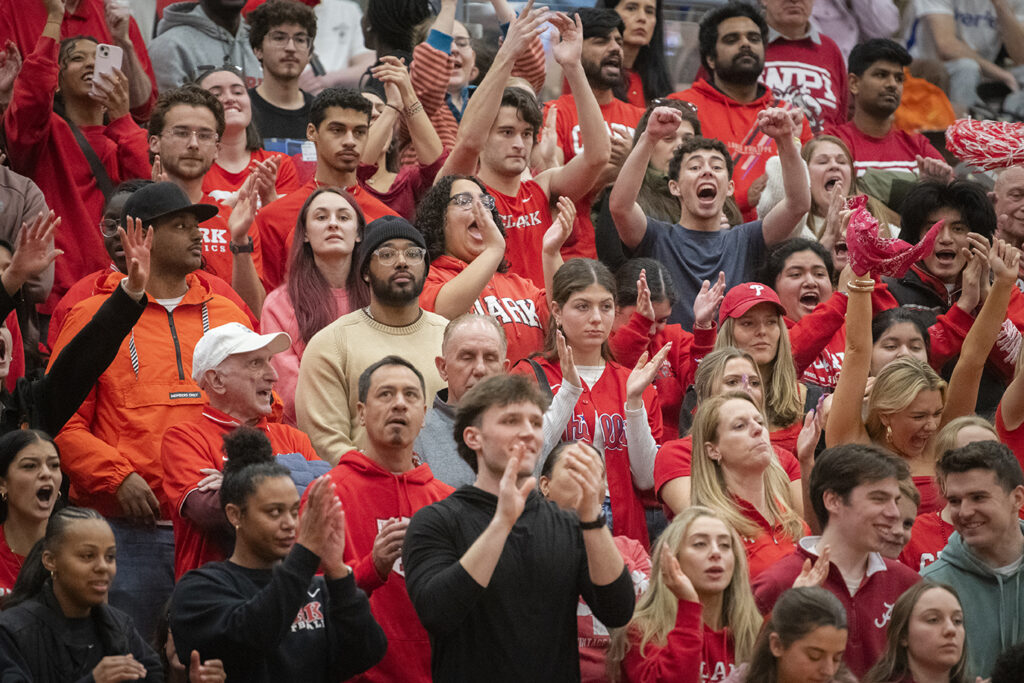 Fans cheer on Clark University men's basketball team during 2025 NEWMAC championship game