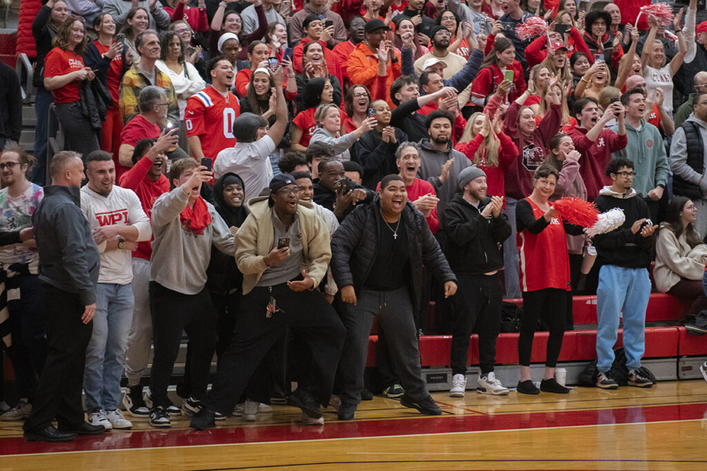Fans cheer on Clark University men's basketball team during 2025 NEWMAC championship game