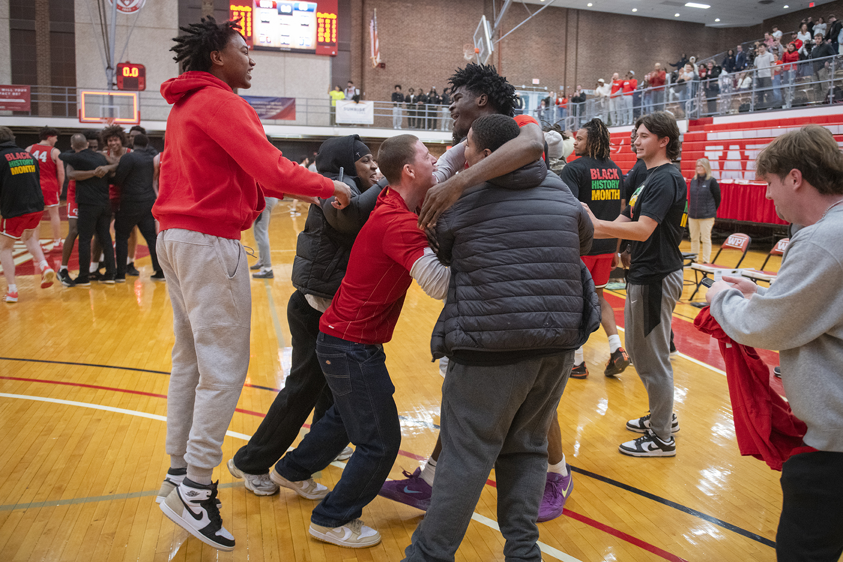 Clark University men's basketball team celebrates win in 2025 NEWMAC championship game