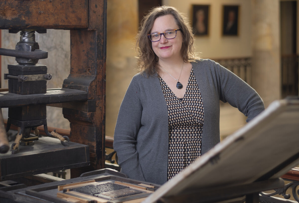 Meredith Neuman with Isaiah Thomas' printing press at the American Antiquarian Society