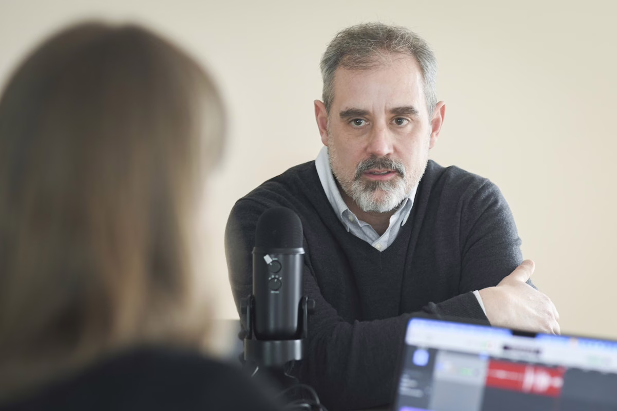 man talking into podcast microphone