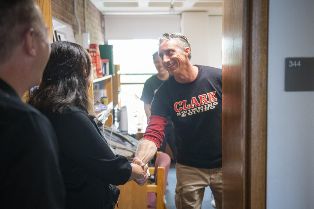 parent shakes hand with dean of students