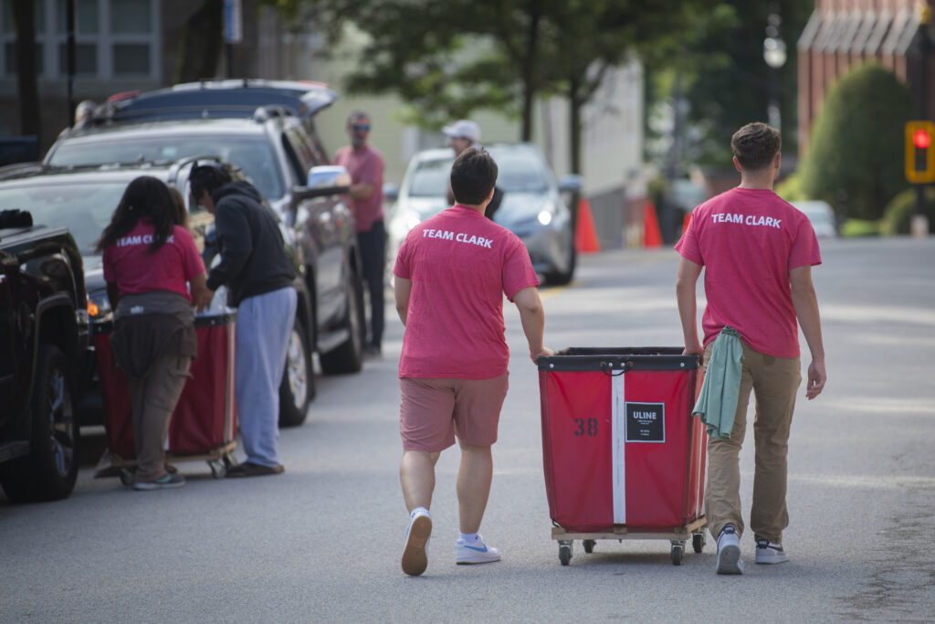 two students move bin