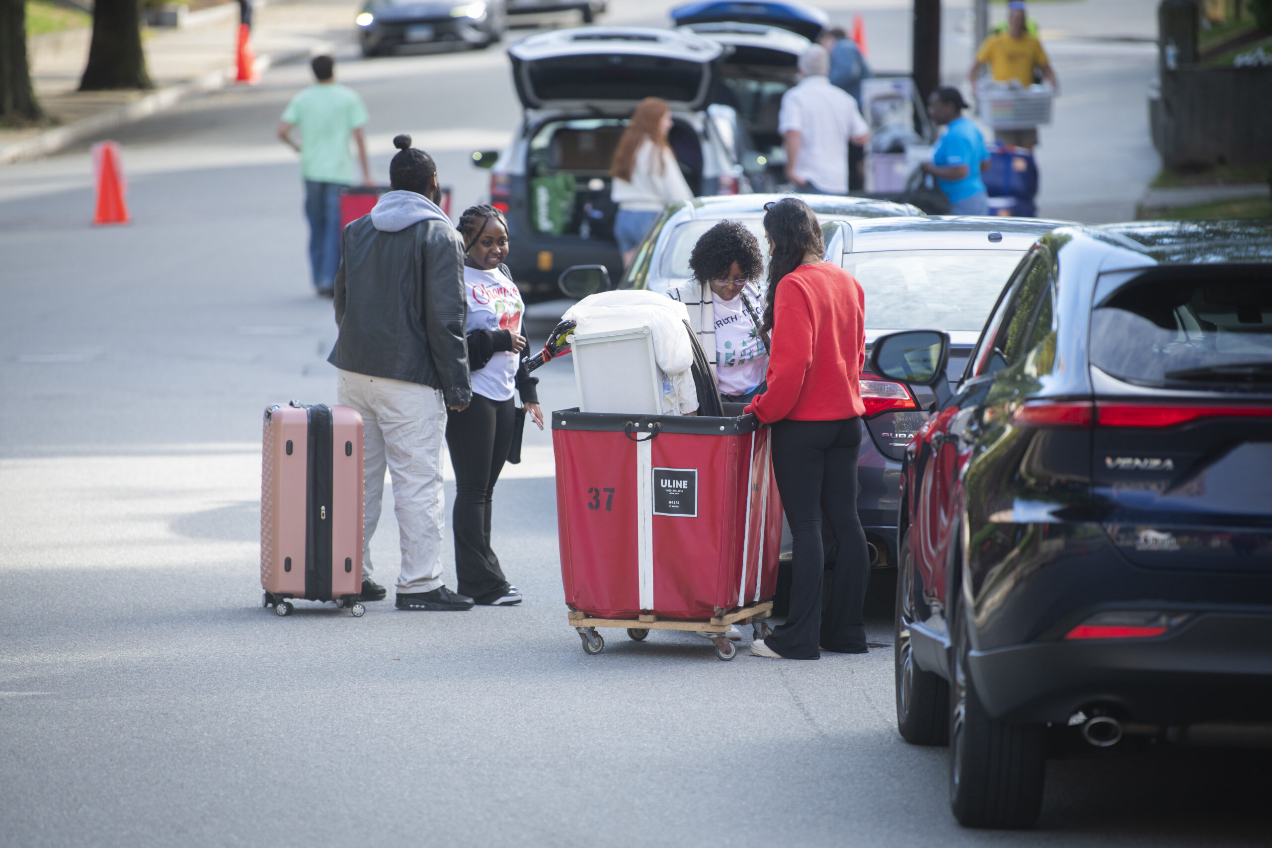 family fills bin with supplies