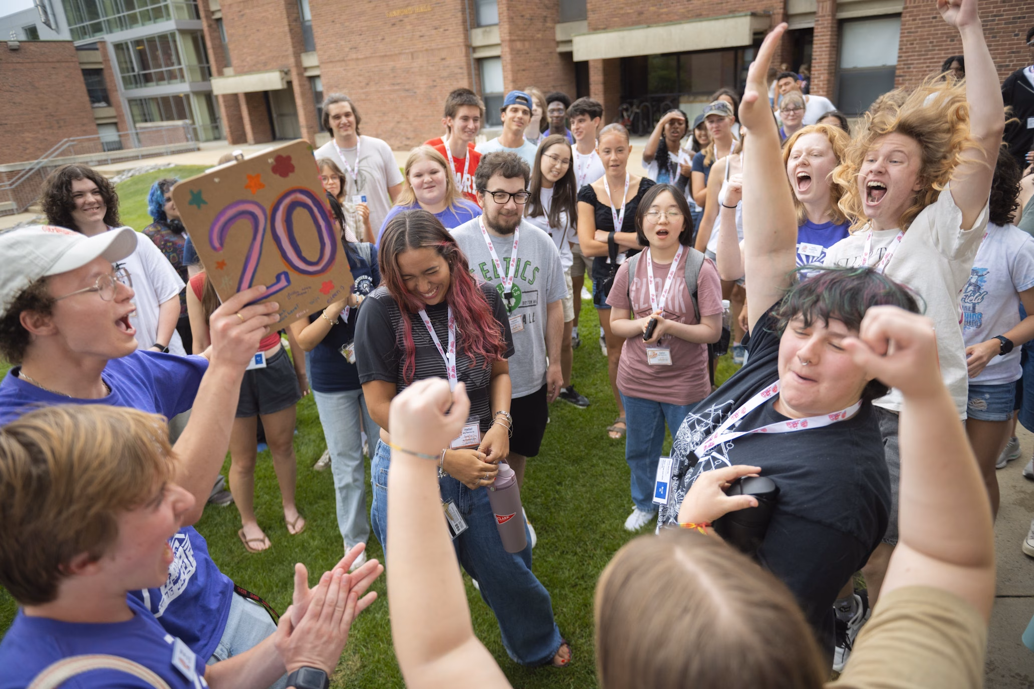 circle of students celebrating