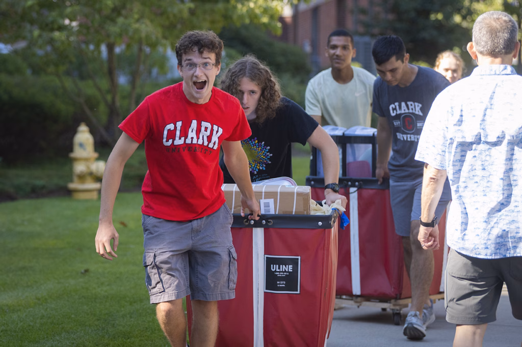 Students push red cart
