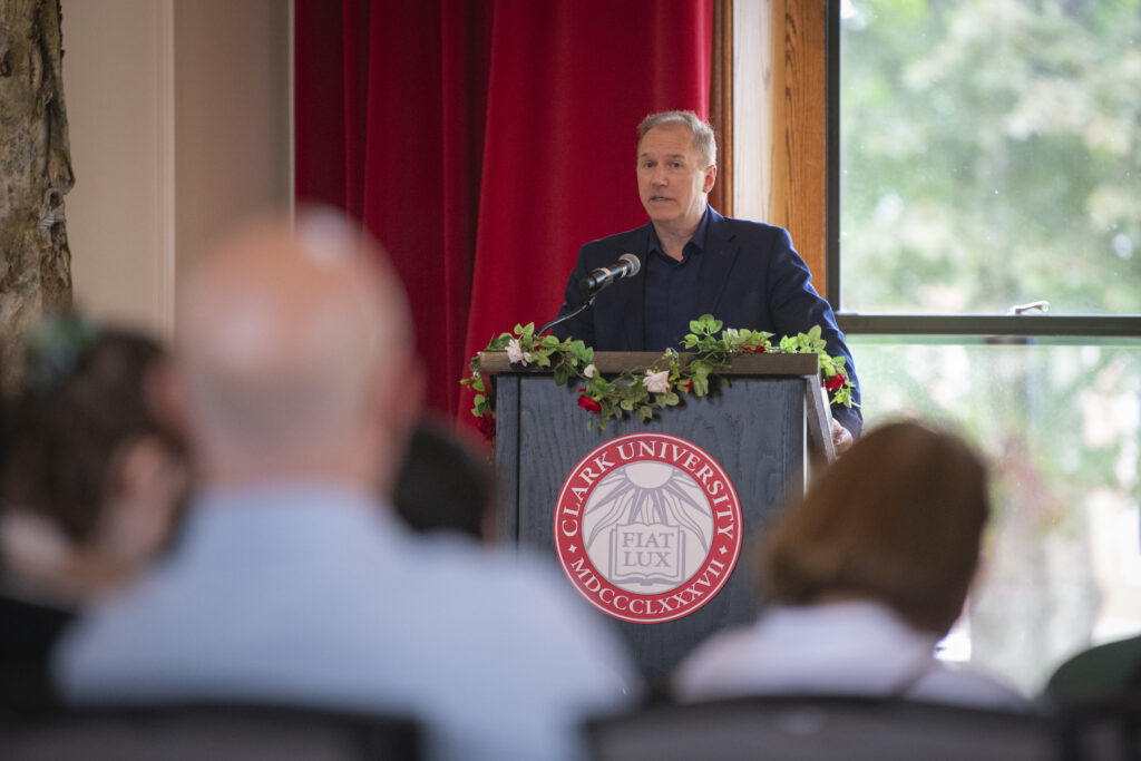 people pose for photos at multicultural graduation ceremony