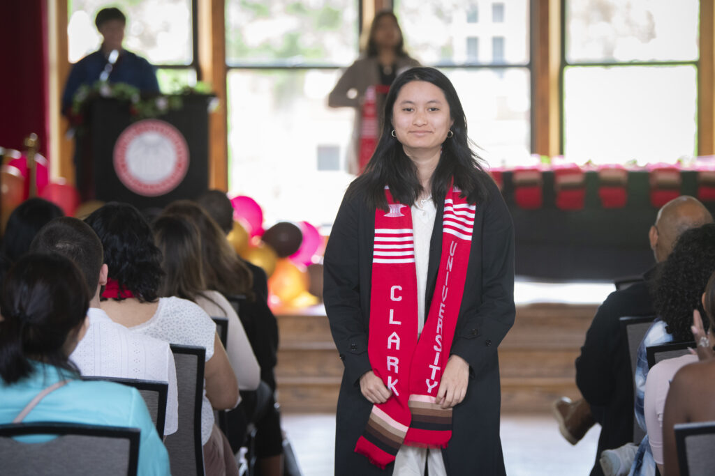 people pose for photos at multicultural graduation ceremony