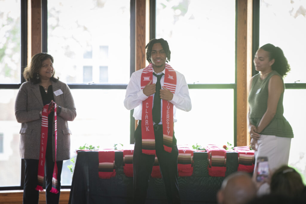 people pose for photos at multicultural graduation ceremony