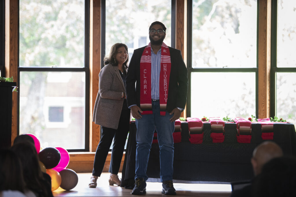 people pose for photos at multicultural graduation ceremony