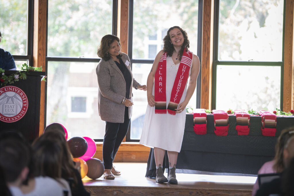 people pose for photos at multicultural graduation ceremony