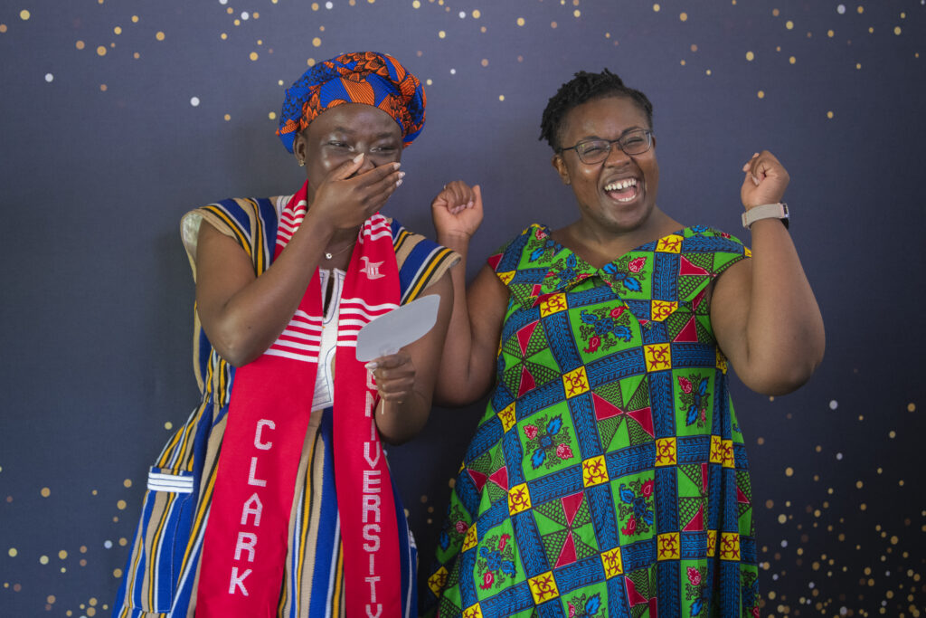 people pose for photos at multicultural graduation ceremony