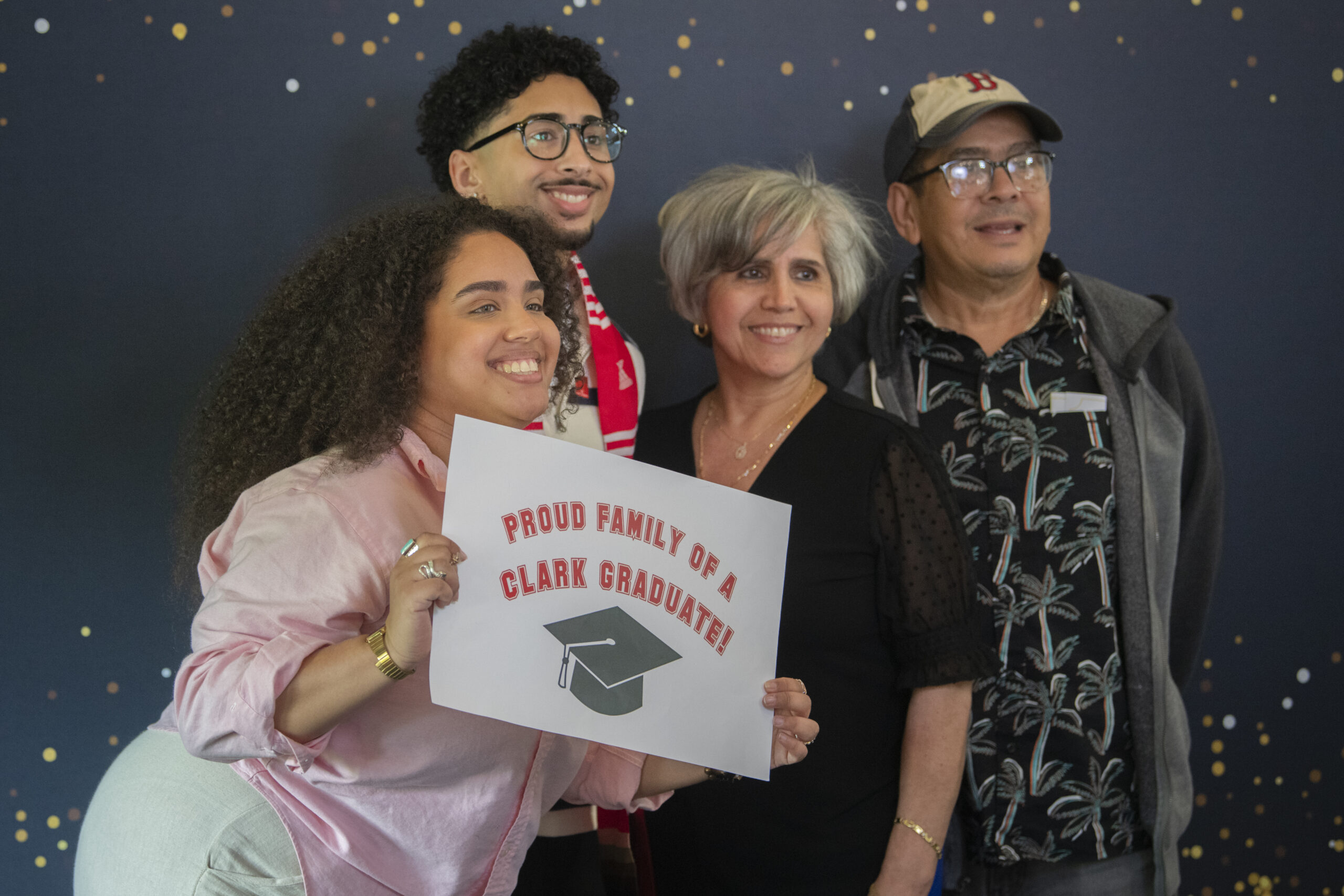 people pose for photos at multicultural graduation ceremony