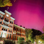The Northern lights at Clark campus over Jonas Hall.